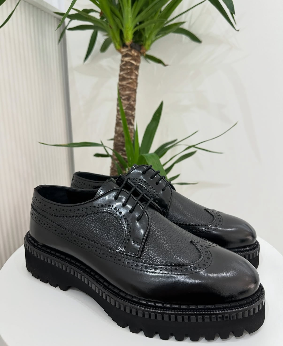 Black Pebbled Leather
Wing-Tip Brogue Platform Shoes