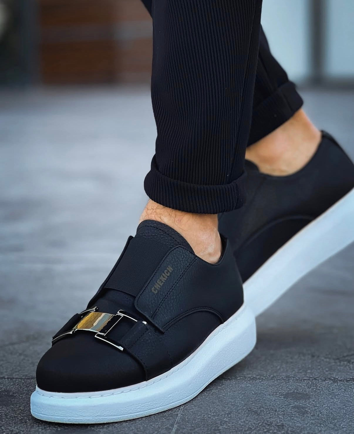 Black and white Chekich slip-on