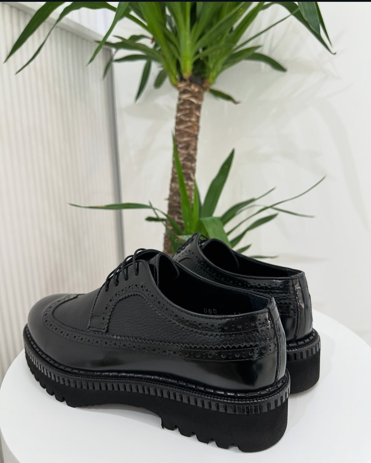 Black Pebbled Leather
Wing-Tip Brogue Platform Shoes