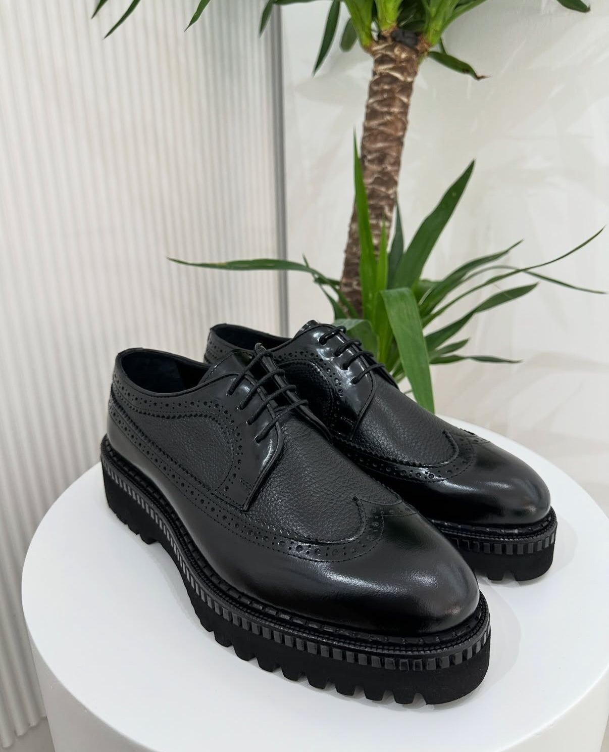 Black Pebbled Leather
Wing-Tip Brogue Platform Shoes